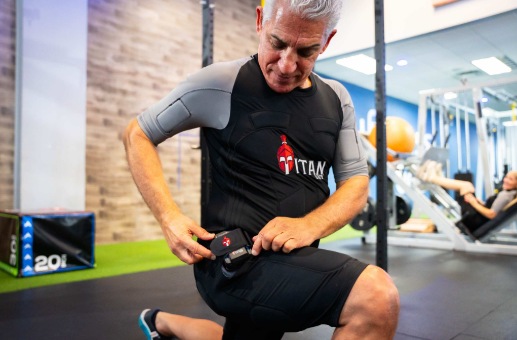 An older man with a TitanBody EMS suit on for father's day.